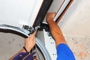 How do you temporarily fix a broken garage door spring