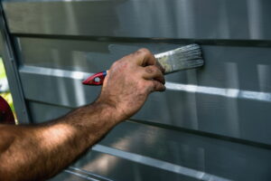 How do you prepare a garage door for painting
