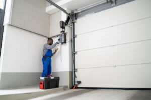 What are the common signs of failing garage door hinges